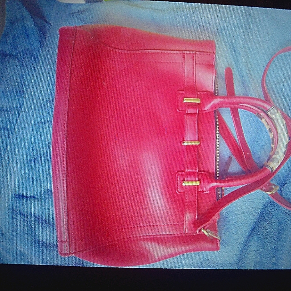 Red, medium size Betsy Johnson purse with cheetah print handles.